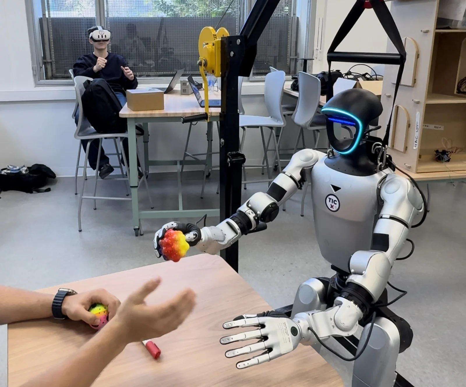Operator using a virtual-reality headset to control a robot